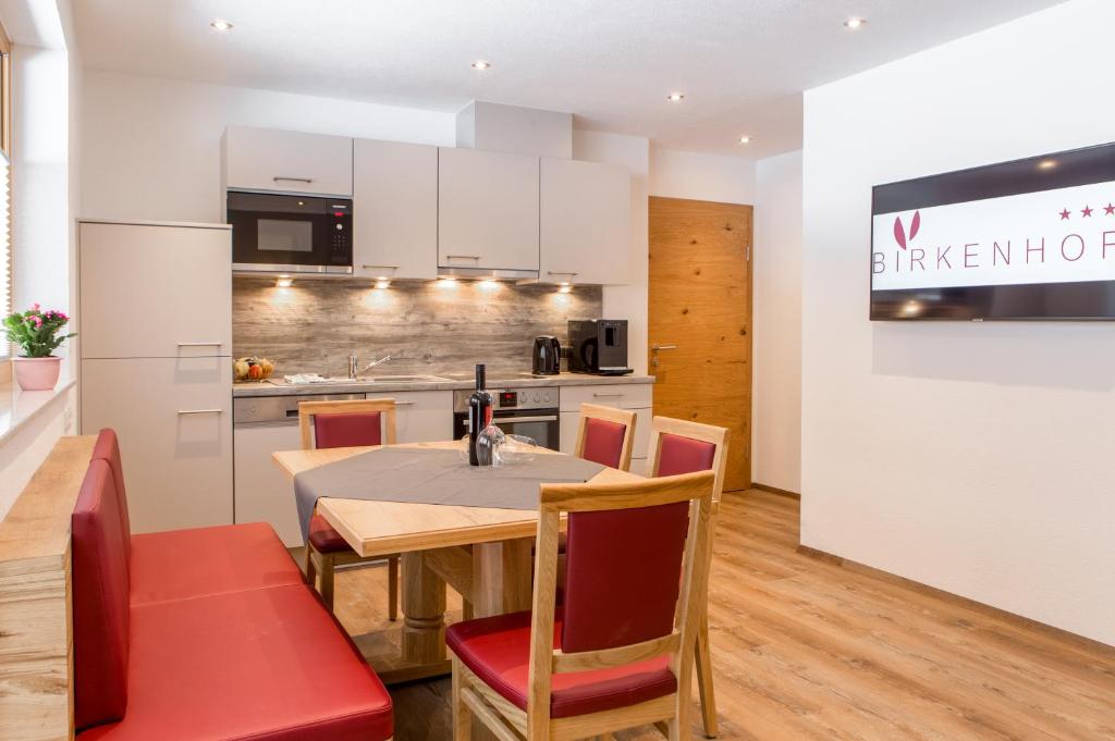 A kitchen or kitchenette at BIRKENHOF premium apart & suites