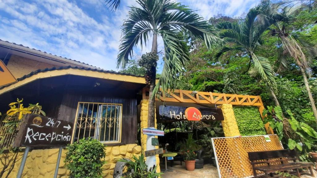 a house with a sign in front of it at Hotel Aurora in Montezuma