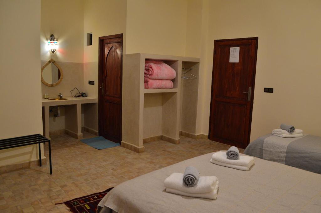 Postel nebo postele na pokoji v ubytování Le Domaine M