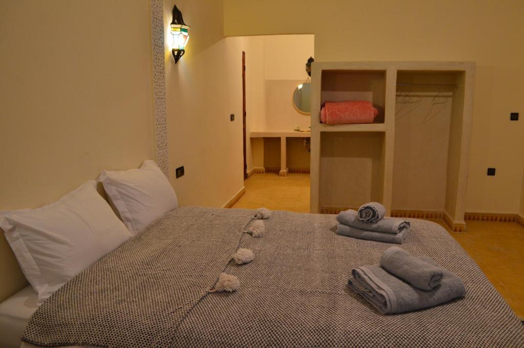 Postel nebo postele na pokoji v ubytování Le Domaine M
