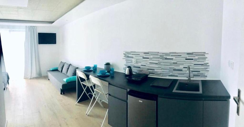 Telewizja i/lub zestaw kina domowego w obiekcie BLOMMA Niechorze