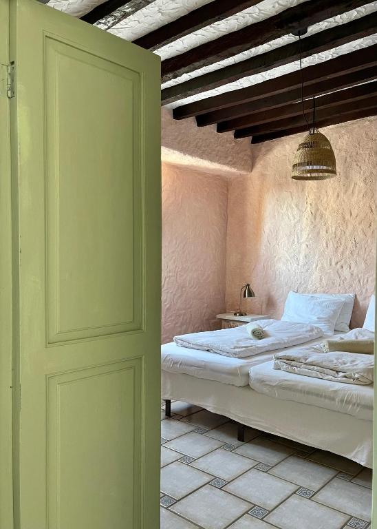 Postel nebo postele na pokoji v ubytování Sansofi Guesthouse