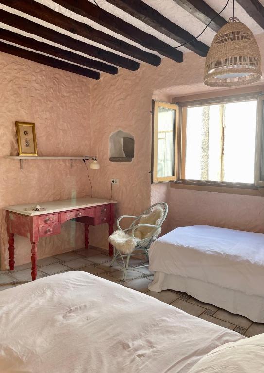 Postel nebo postele na pokoji v ubytování Sansofi Guesthouse