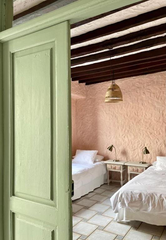 Postel nebo postele na pokoji v ubytování Sansofi Guesthouse