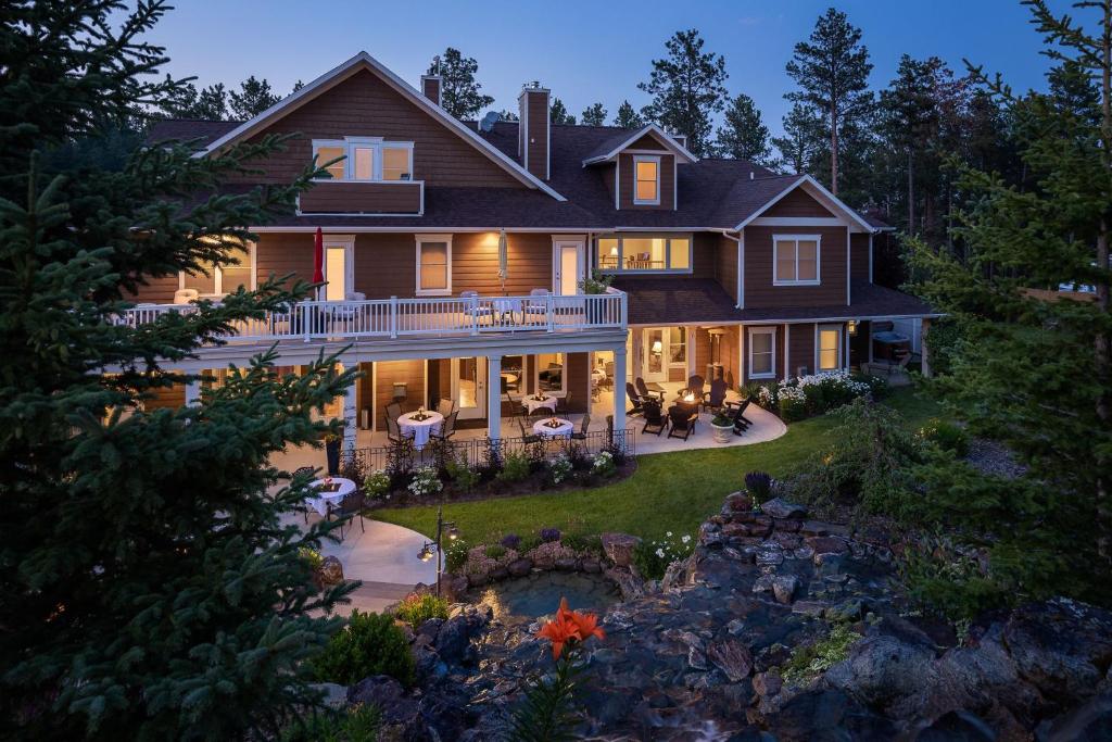 an aerial view of a house with a backyard at Summer Creek Inn in Rapid City