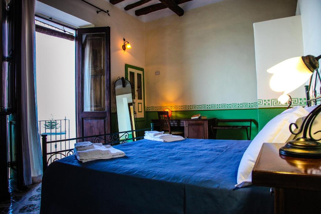 Postel nebo postele na pokoji v ubytování Hotel Arcangelo - Salina