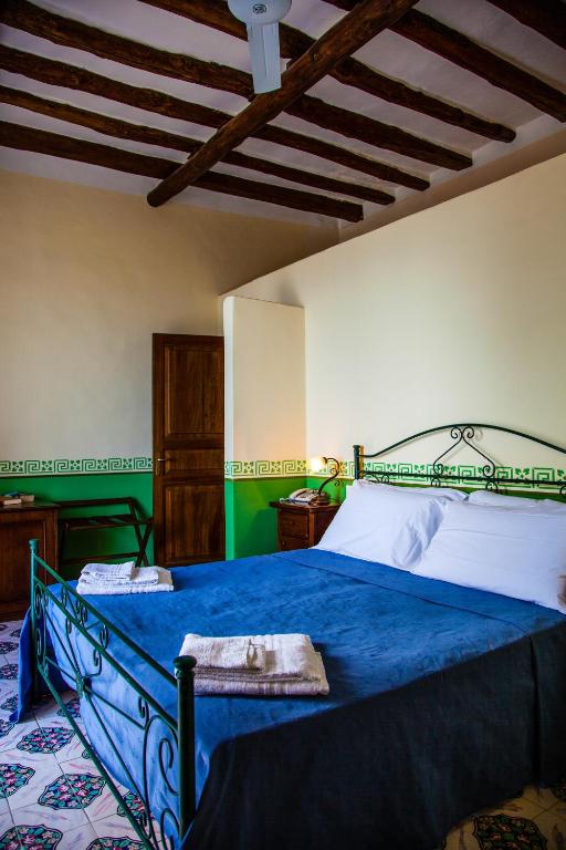 Postel nebo postele na pokoji v ubytování Hotel Arcangelo - Salina