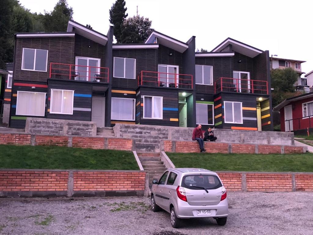 a car parked in front of a building at CABAÑAS ANAHUAC in Puerto Montt