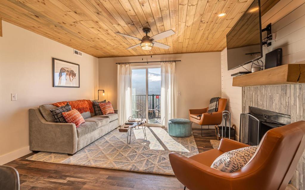 a living room with a couch and a fireplace at Morning Vista in Gatlinburg