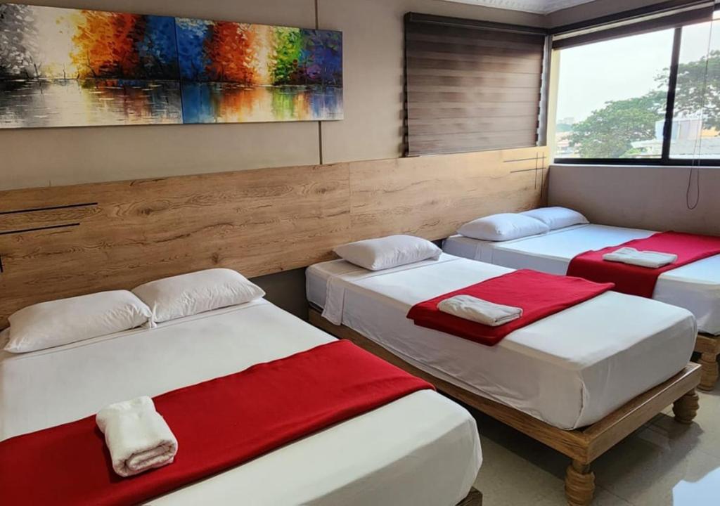 Postel nebo postele na pokoji v ubytování Hotel Murali - Cerca del Aeropuerto de Guayaquil