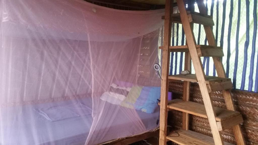 Palanda nebo palandy na pokoji v ubytování Le A, Trou du Prophète
