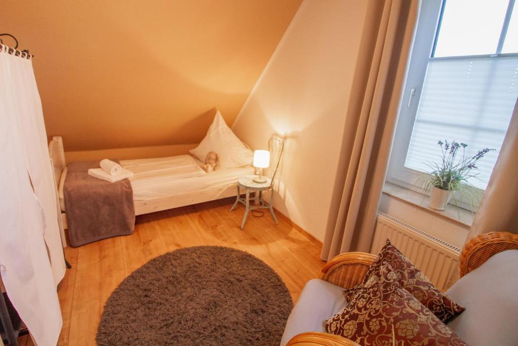 Postel nebo postele na pokoji v ubytování Greetsieler Inselhuus - Westwind