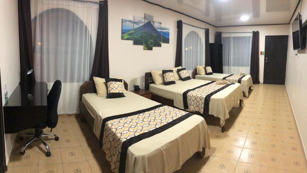 Postel nebo postele na pokoji v ubytování HOTEL DEL RiO
