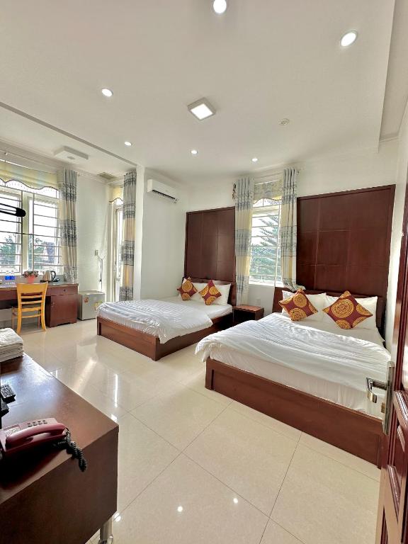Postel nebo postele na pokoji v ubytování Hoàng Anh hotel