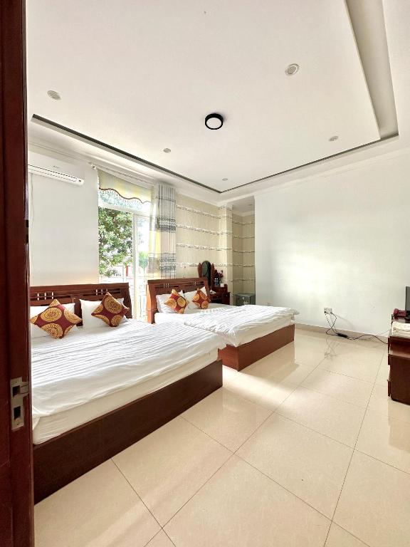 Postel nebo postele na pokoji v ubytování Hoàng Anh hotel