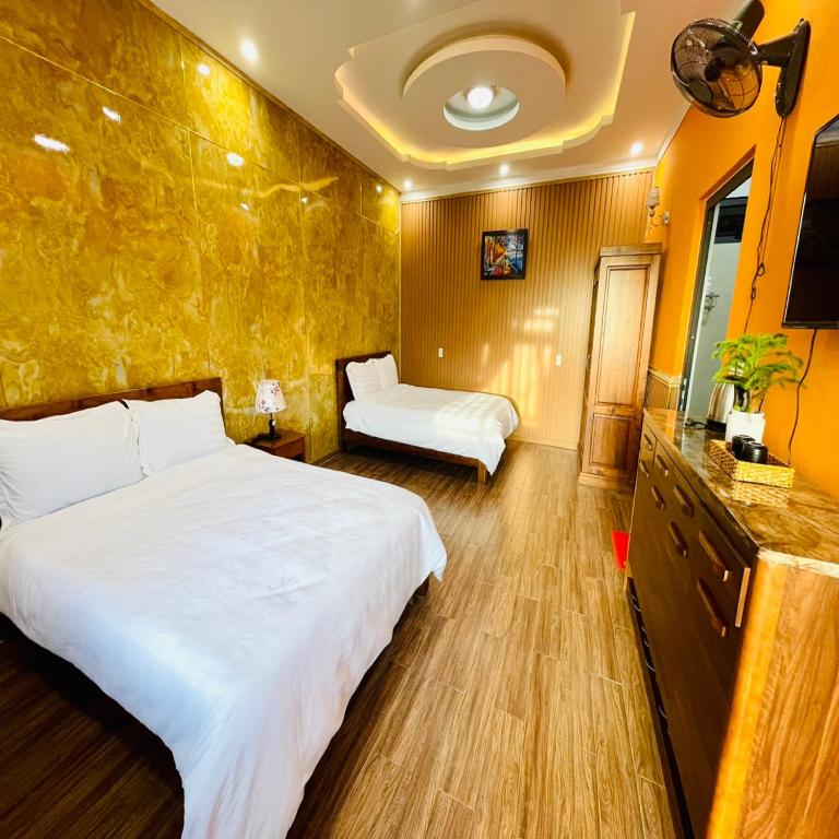 Postel nebo postele na pokoji v ubytování Pine Forest House Dalat