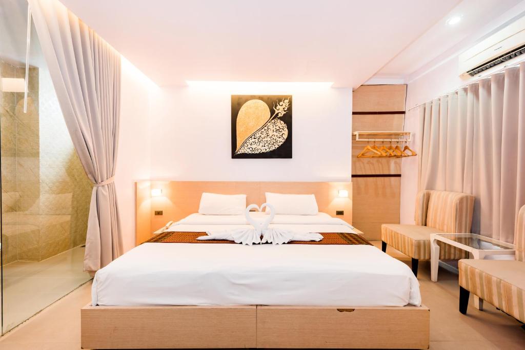Postel nebo postele na pokoji v ubytování My Hotel Phuket