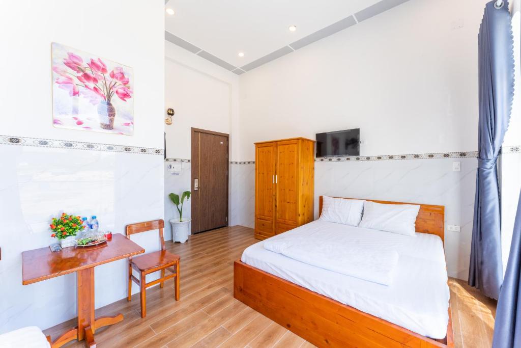 Postel nebo postele na pokoji v ubytování Homestay Bảo Châu - Nhơn Lý Quy Nhơn