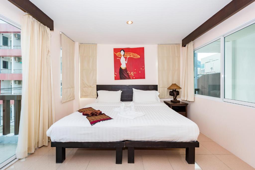Postel nebo postele na pokoji v ubytování My Hotel Phuket
