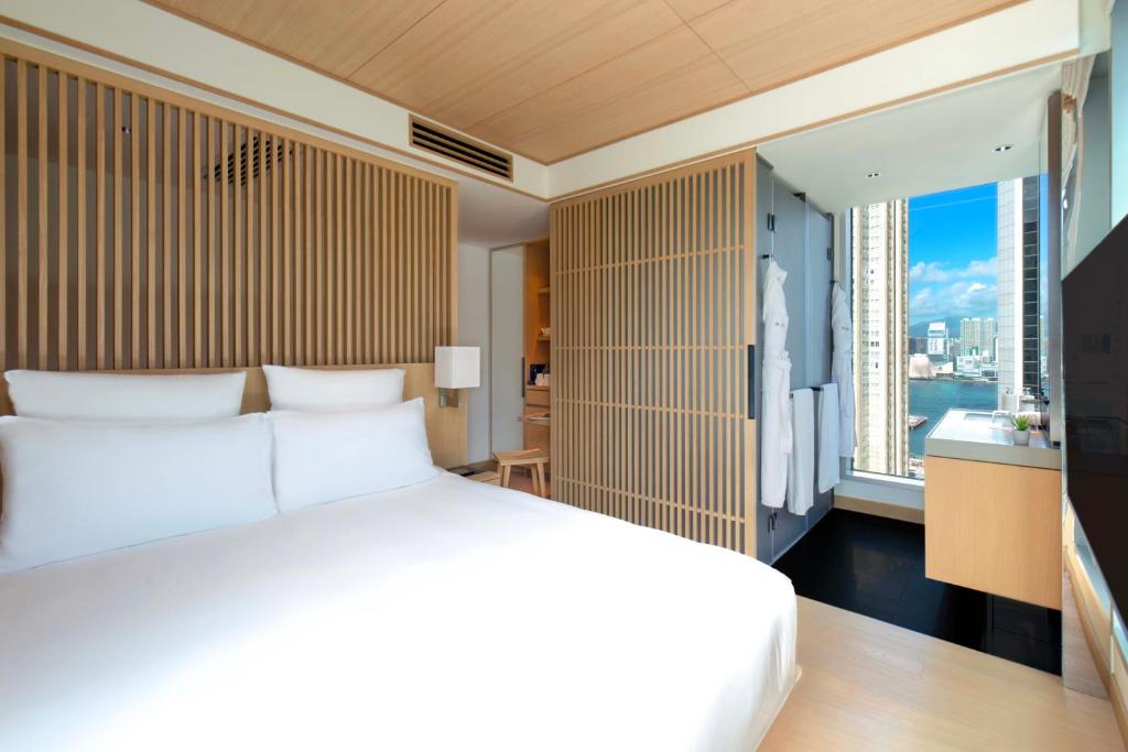 Letto o letti in una camera di AKI Hong Kong - MGallery