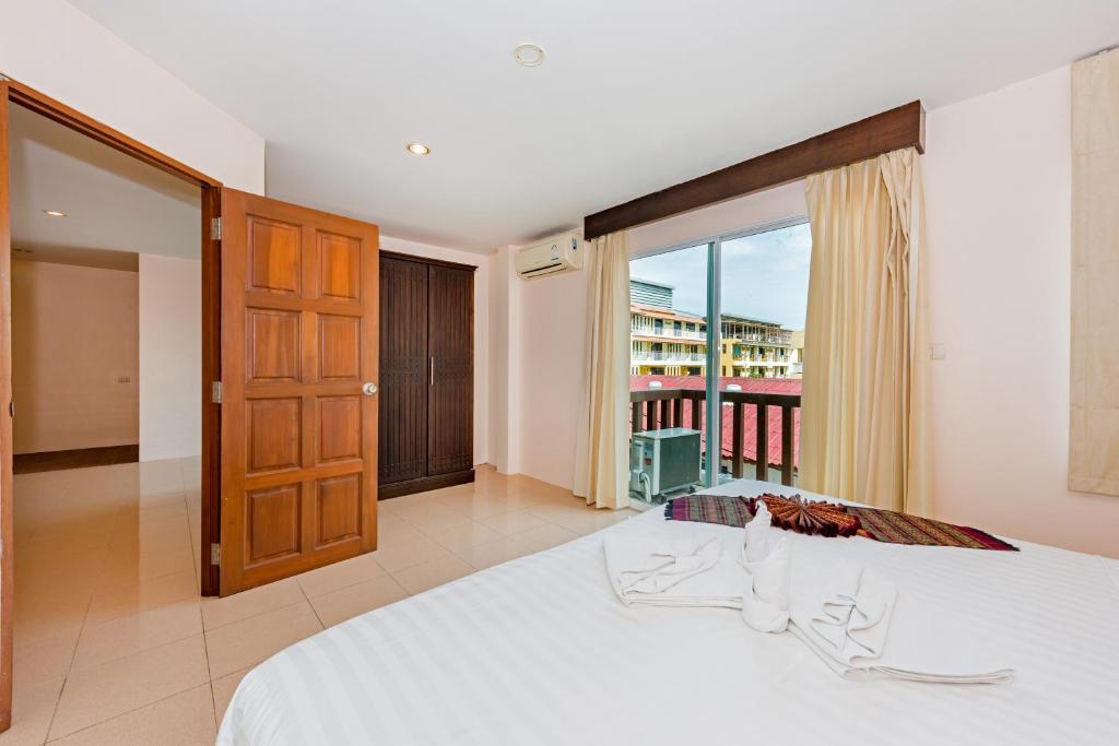 Postel nebo postele na pokoji v ubytování My Hotel Phuket