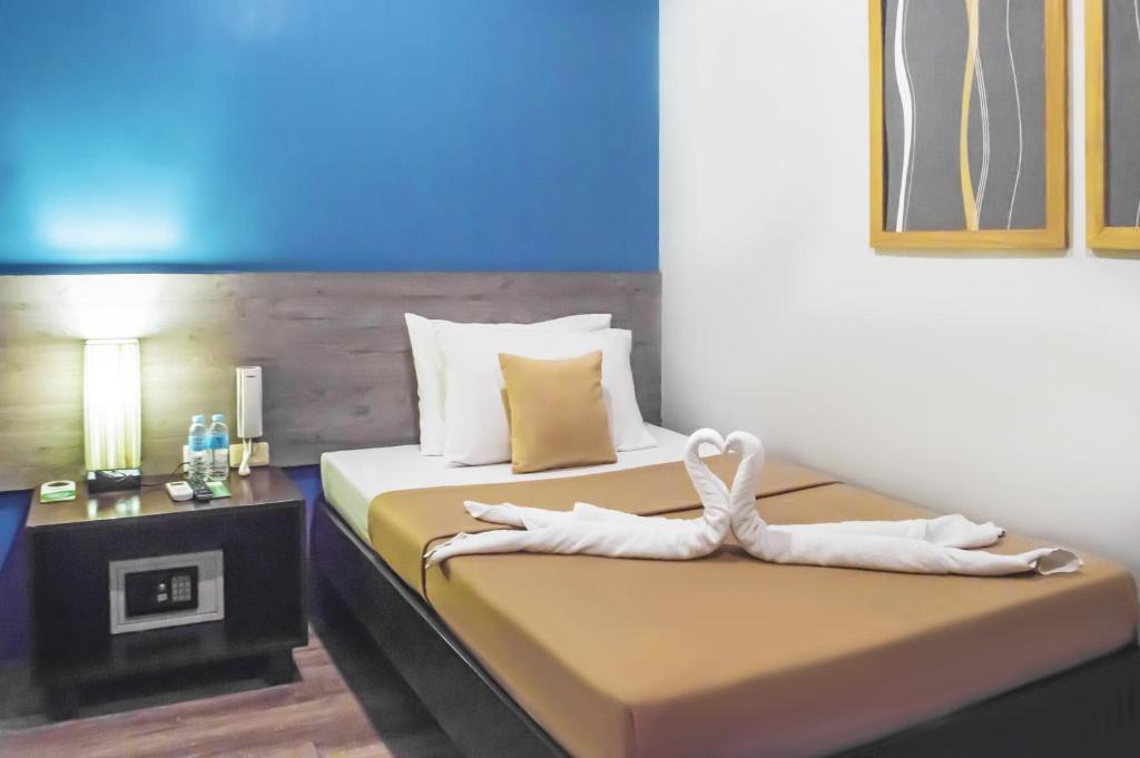 Postel nebo postele na pokoji v ubytování Sheridan Boutique Hotel