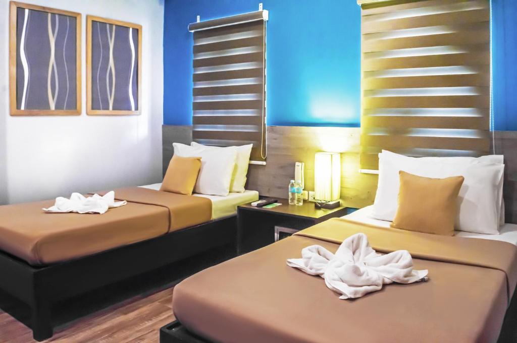 Postel nebo postele na pokoji v ubytování Sheridan Boutique Hotel