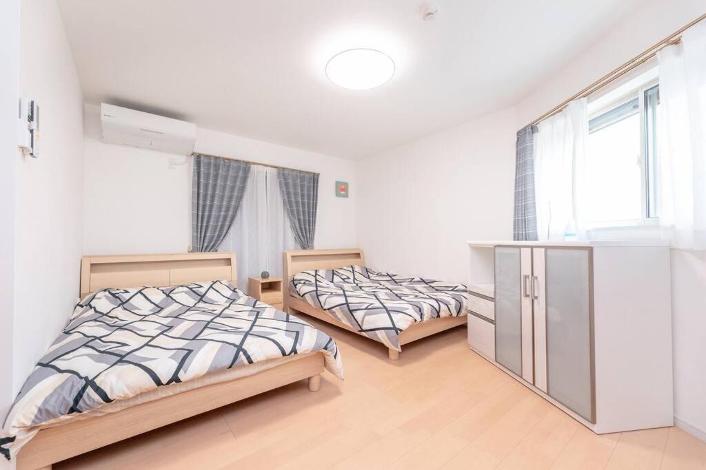 Postel nebo postele na pokoji v ubytování 合綠の宿 205
