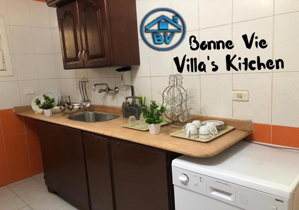 Kuchyň nebo kuchyňský kout v ubytování Bonne Vie Hotel