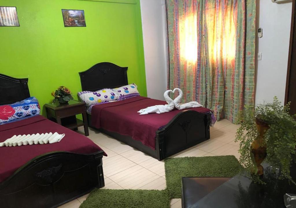 Postel nebo postele na pokoji v ubytování Bonne Vie Hotel