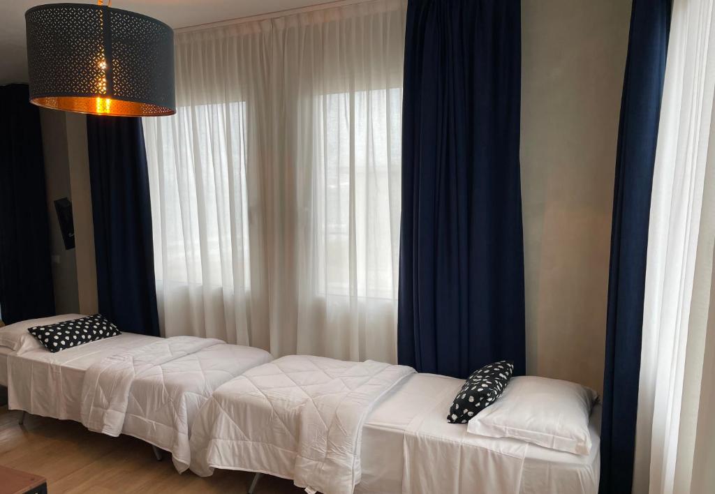 Postel nebo postele na pokoji v ubytování Hotel Concordia