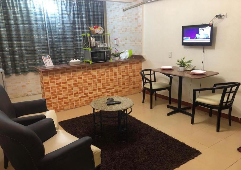 TV a/nebo společenská místnost v ubytování Bonne Vie Hotel
