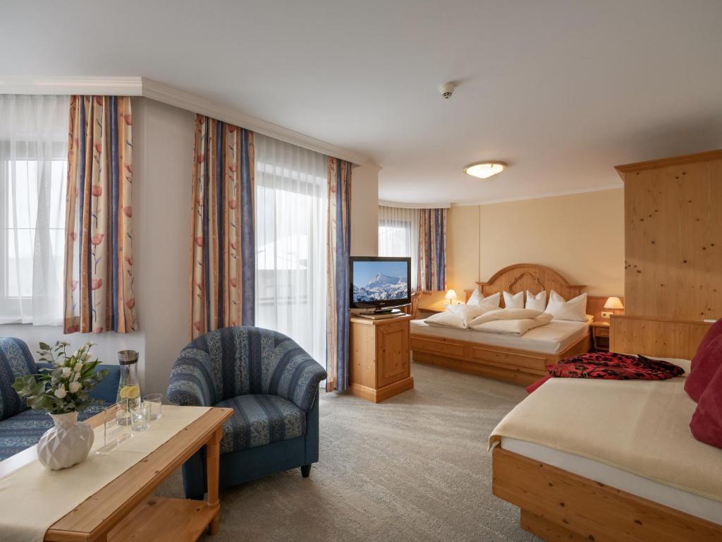 Postel nebo postele na pokoji v ubytování Hotel Andrea