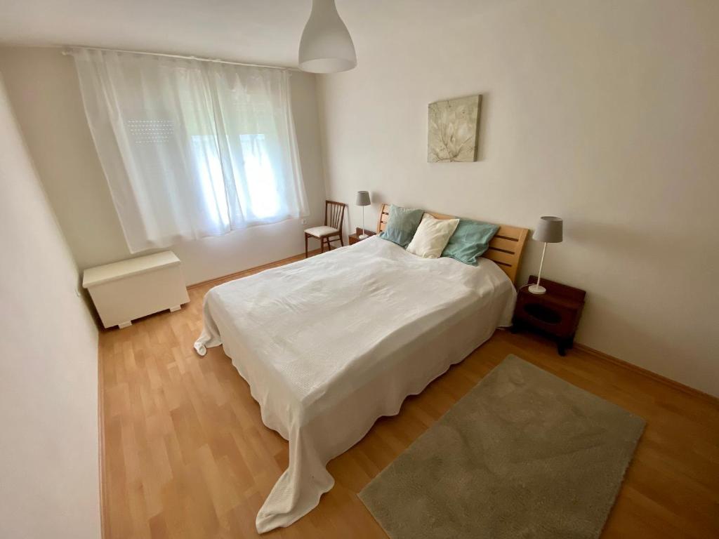 Posteľ alebo postele v izbe v ubytovaní Kertvárosi Rigó Pihenőház