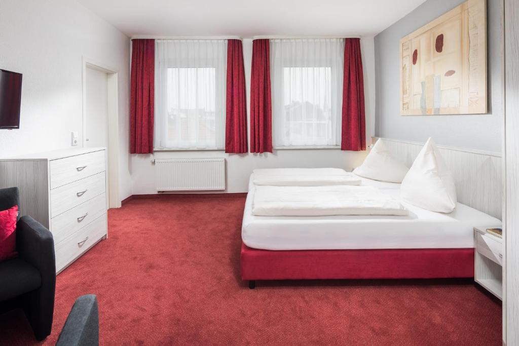 Postel nebo postele na pokoji v ubytování Gästehaus Bakker