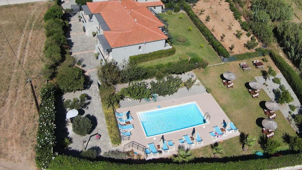 an aerial view of a house with a swimming pool at Caviro in Moúdhros