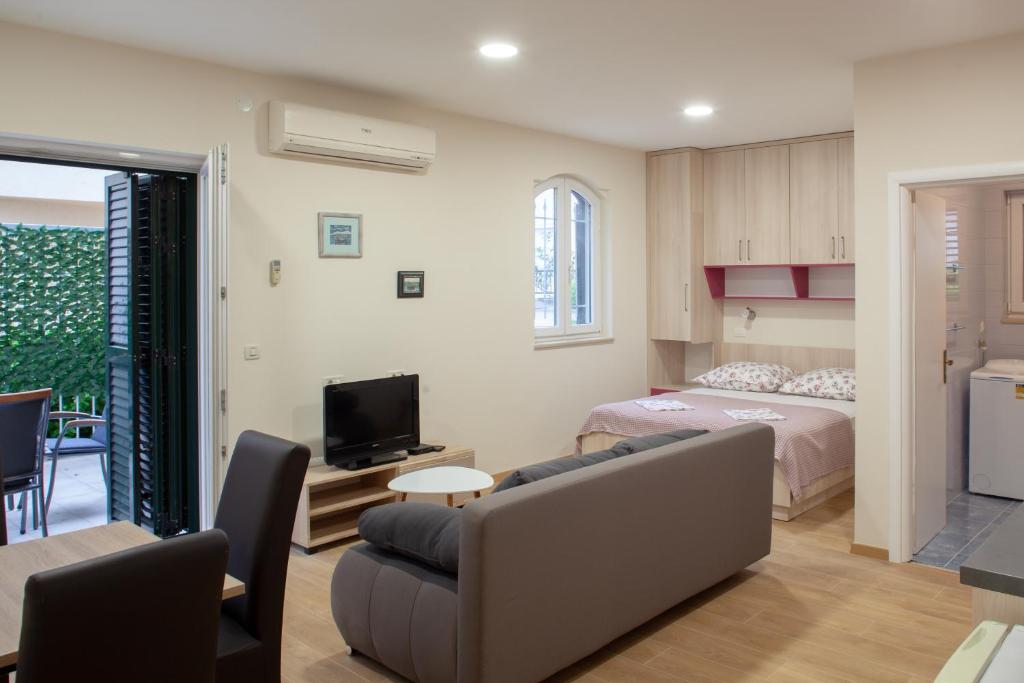 Posteľ alebo postele v izbe v ubytovaní Apartmani Vito i Cvita