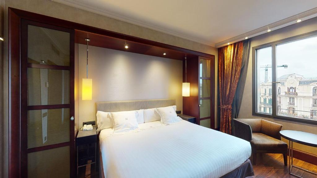 Posteľ alebo postele v izbe v ubytovaní Hotel Barcelona Center