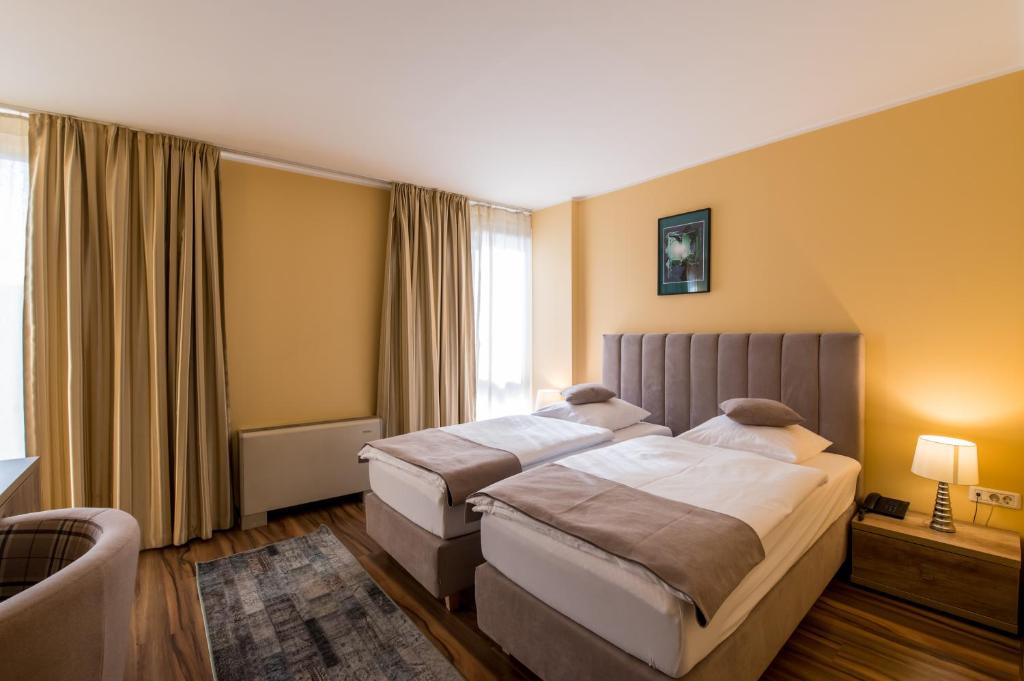 Postel nebo postele na pokoji v ubytování Hotel Perla