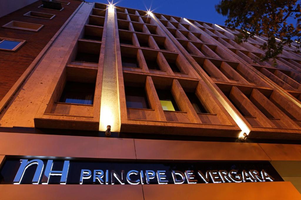 a building with a sign on the side of it at NH Madrid Principe de Vergara in Madrid