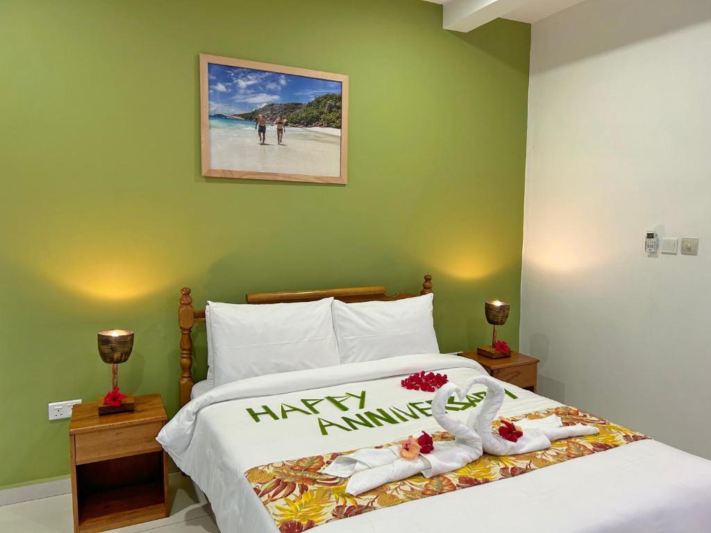 Postel nebo postele na pokoji v ubytování The Seaboards Apartments Seychelles