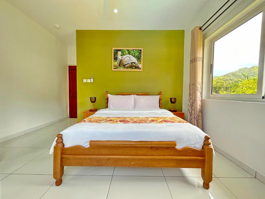 Postel nebo postele na pokoji v ubytování The Seaboards Apartments Seychelles