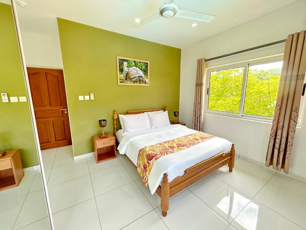 Postel nebo postele na pokoji v ubytování The Seaboards Apartments Seychelles