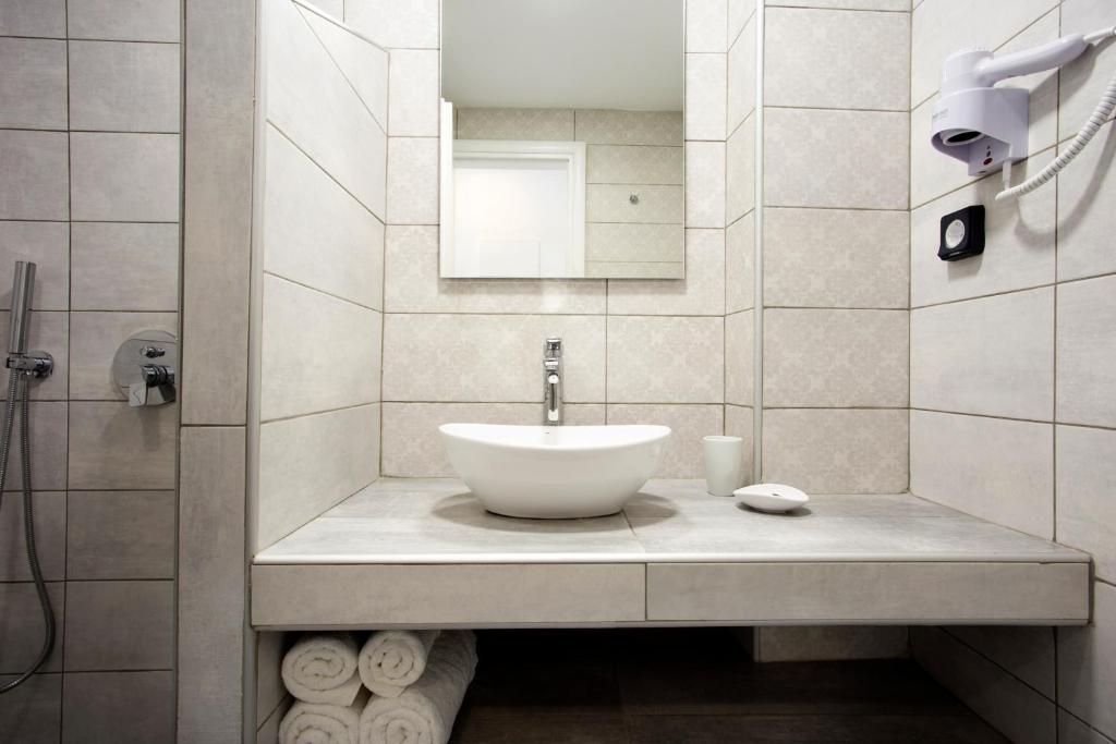 Koupelna v ubytování Alexandra Hotel