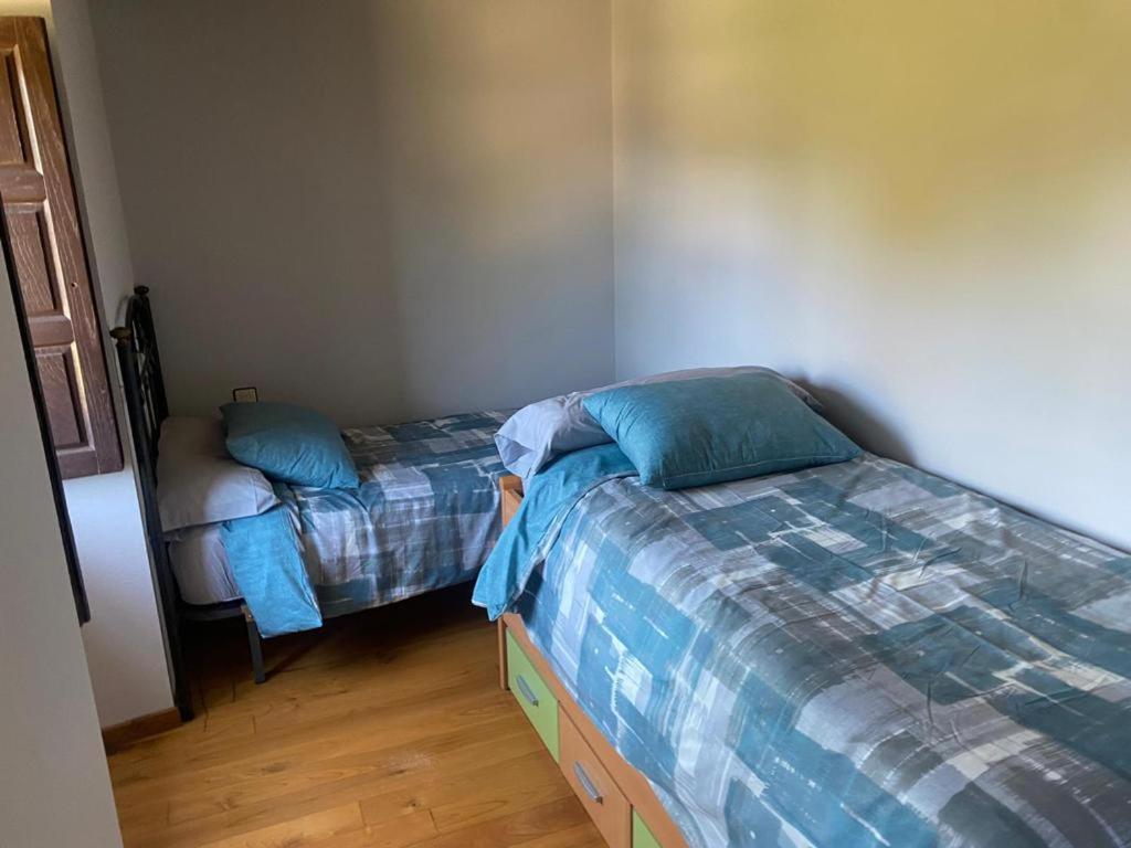 Postel nebo postele na pokoji v ubytování Casa Ezequiel