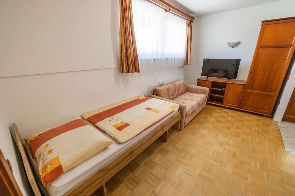 Postel nebo postele na pokoji v ubytování Apartments Galunder