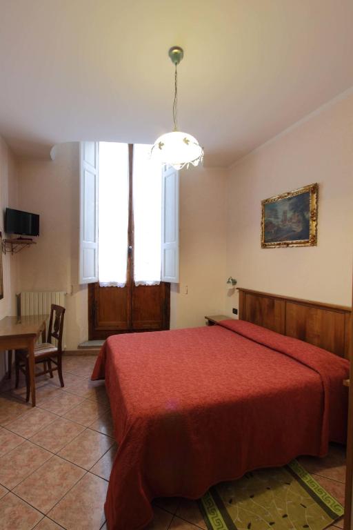 Posteľ alebo postele v izbe v ubytovaní Hotel Margaret