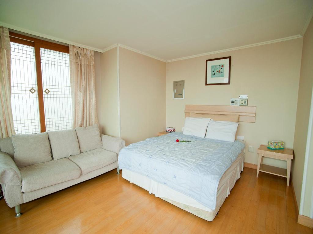 Postel nebo postele na pokoji v ubytování Hotel Good Inn
