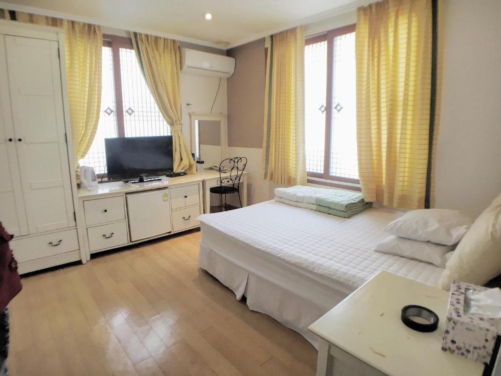 Postel nebo postele na pokoji v ubytování Hotel Good Inn