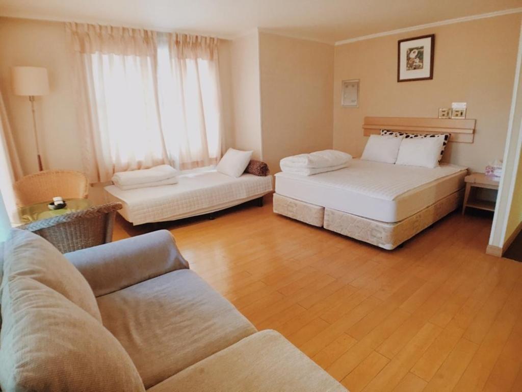 Postel nebo postele na pokoji v ubytování Hotel Good Inn